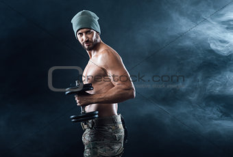 Cool attractive man lifting weights