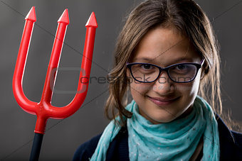 little girl with a big pitchfork