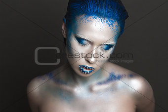 Artistic Makeup with Blue Hair and Rhinestones