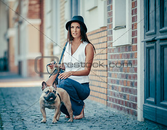 Young woman walking with dog