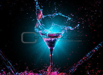 Colourful cocktail in glass with splash