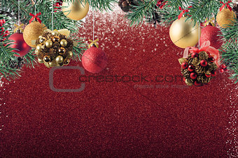 Xmas decoration on sparkly red glitter background