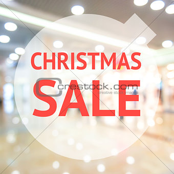 Christmas season sale sign over blurred background