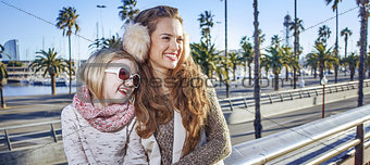 mother and daughter traveller in Barcelona looking into distance