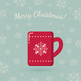 Red mug on winter backdrop.