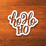 Ho-Ho-Ho lettering on paper label