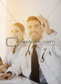 group of happy doctors on conference at hospital