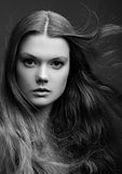 Portrait of beautiful young girl with long hair