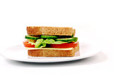 Healthy ham sandwich with cheese, tomatoes on white background