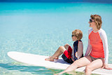 family stand up paddling