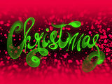 Christmas word lettering written with green fire flame or smoke on blurred bokeh background