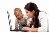 mother and baby girl having fun with laptop