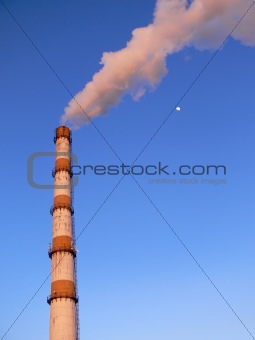 Smoking factory pipe with moon