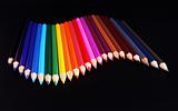 Color pencils wave isolated on black