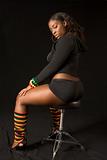 Glamorous African-American girl on stool