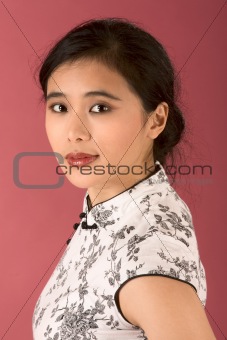 Chinese girl in white cheongsam
