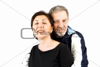 Couple Hugging while Looking At the Camera