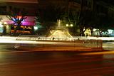 Fountain at night and trafic