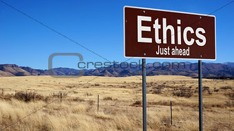 Ethics brown road sign