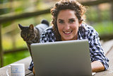 woman outdoors with a laptop computer