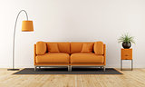 Modern living room with orange couch