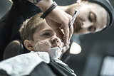 Humorous shaving of little boy