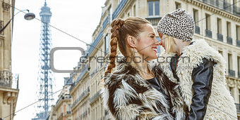 mother and daughter in Paris, France looking at each other