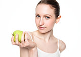 Beautiful fitness women holding healthy apple 