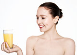 Beautiful woman holding glass with orange juice