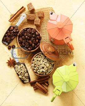 Still life of coffee - green and brown beans and spices, cinnamon and anise