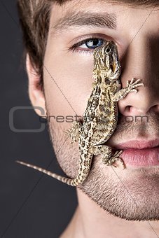 Portrait of a Young Handsome Man with Lizard on His Face