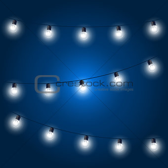 Christmas Lights - festive light bulbs garland on blue