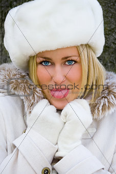 Blond Woman Girl White Fur Hat, Coat Sticking Out her Tongue