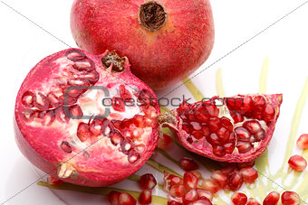 Pomegranate and seeds on plate