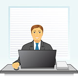Smiling businessman with laptop in office
