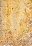 Old stucco wall texture of yellow color