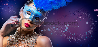 disco woman wearing silver accessories on black backgound