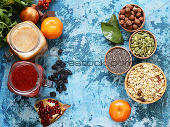 Still life super food - smoothies, muesli, nuts, berries, chia seeds