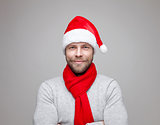 Handsome man with beard wearing a Christmas hat