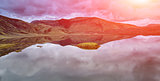 Lake coast with mountain reflection, Iceland