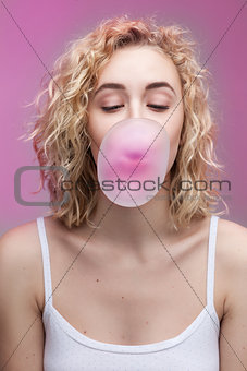 girl doing bubble with a chewing gum