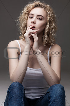 fashion portrait of blond sitting woman