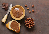 Chocolate paste spread with hazelnuts and bread for breakfast