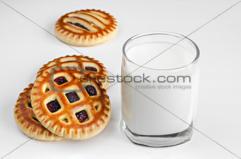 Biscuits with filling and a glass of milk