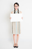 Oriental girl holding white paper card