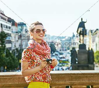 woman on Vaclavske namesti in Prague with digital camera