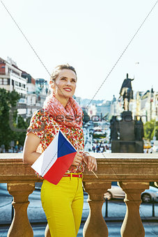 young tourist woman in Prague Czech Republic with Czech flag