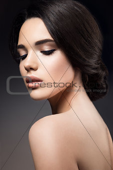 Close-up portrait of beautiful woman with bright makeup
