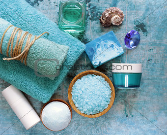 Spa concept turquoise - soap, salt, cream, towel