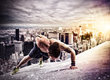 Workout  above the roof of a building in the city